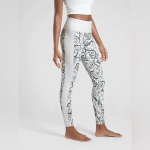 NWT Athleta women’s Affirmation 7/8 tights white with floral print. Size Small